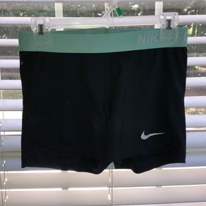 Blue-green nike pros